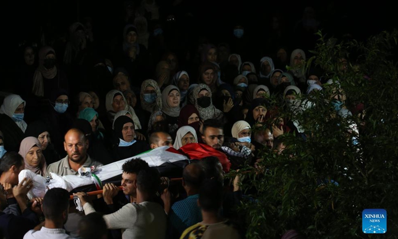 People carry the body of Palestinian man Mohammed Khbeisa during his funeral in the village of Beita, near the northern West Bank city of Nablus, on Sept. 24, 2021.Photo:Xinhua