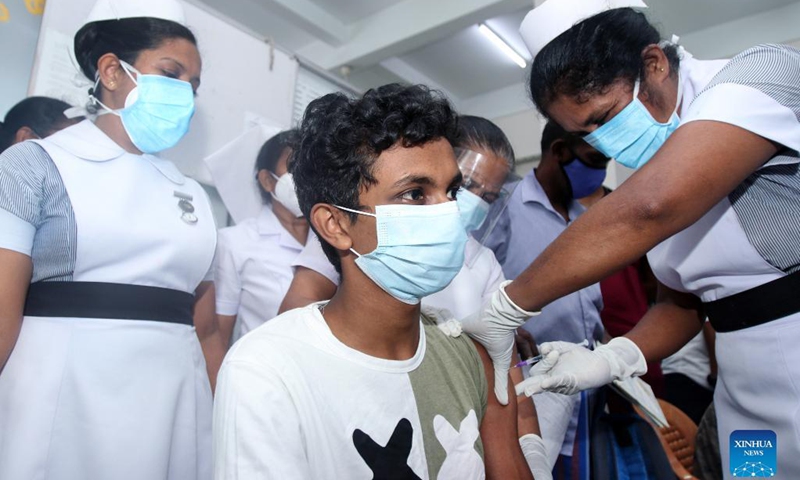 A boy receives a dose of COVID-19 vaccine at a hospital in Colombo, Sri Lanka, Sept. 24, 2021. Sri Lankan authorities on Friday began administering the COVID-19 vaccines to children aged 12 to 19 years who have comorbidities and are disabled.Photo:Xinhua