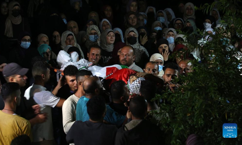 People carry the body of Palestinian man Mohammed Khbeisa during his funeral in the village of Beita, near the northern West Bank city of Nablus, on Sept. 24, 2021.Photo:Xinhua
