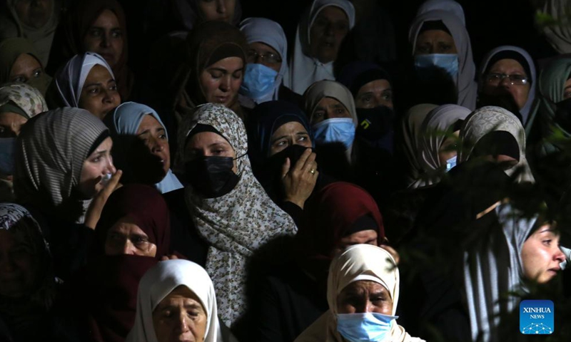 People mourn during the funeral of Palestinian man Mohammed Khbeisa in the village of Beita, near the northern West Bank city of Nablus, on Sept. 24, 2021.Photo:Xinhua