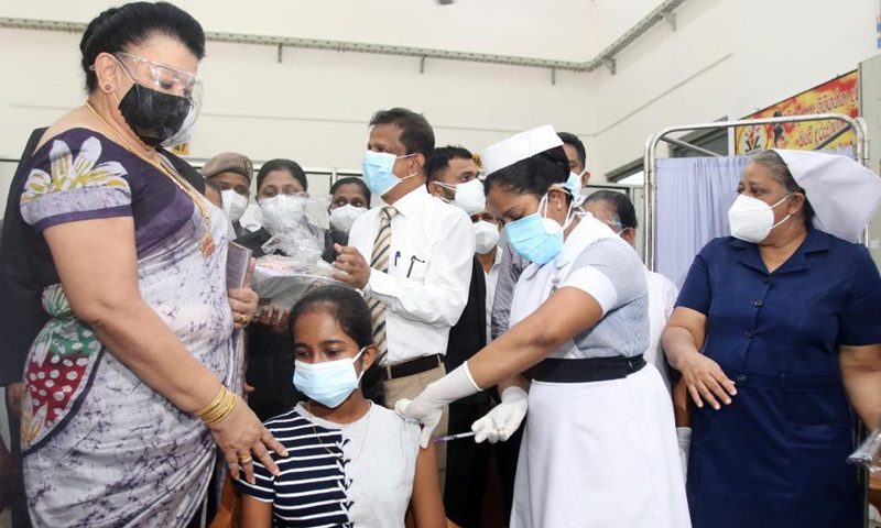 A girl receives a dose of COVID-19 vaccine at a hospital in Colombo, Sri Lanka, Sept. 24, 2021. Sri Lankan authorities on Friday began administering the COVID-19 vaccines to children aged 12 to 19 years who have comorbidities and are disabled.Photo:Xinhua