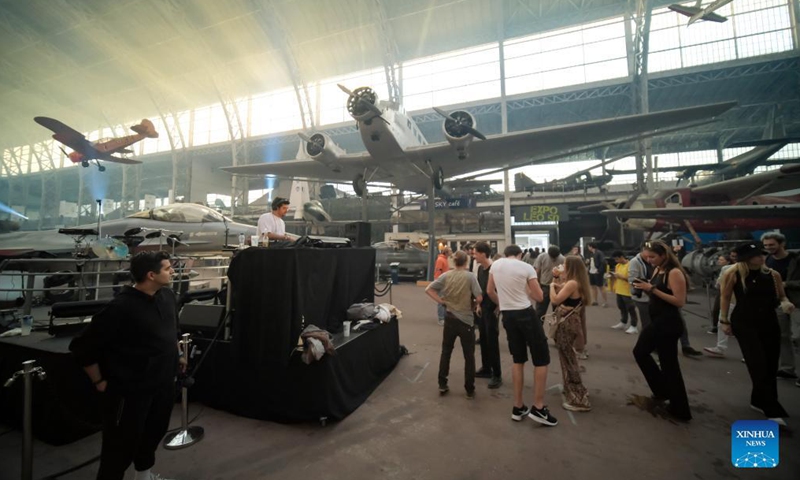 People attend the IIIMAGINE live electronic music show at the Aviation Hall of the Royal Museum of the Armed Forces and Military History in Brussels, Belgium, on Sep 24, 2021.Photo:Xinhua