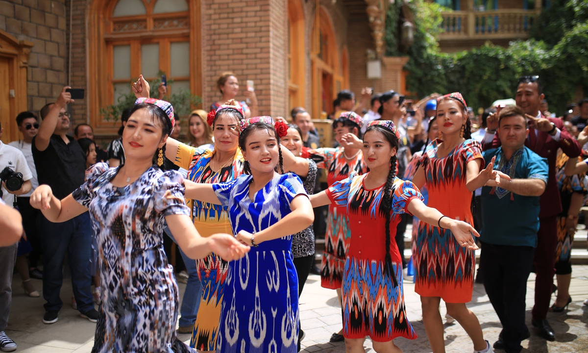 Local residents in Tuancheng, Hotan Prefecture dance for the Corban Festival. Photo: Liu Xin/GT