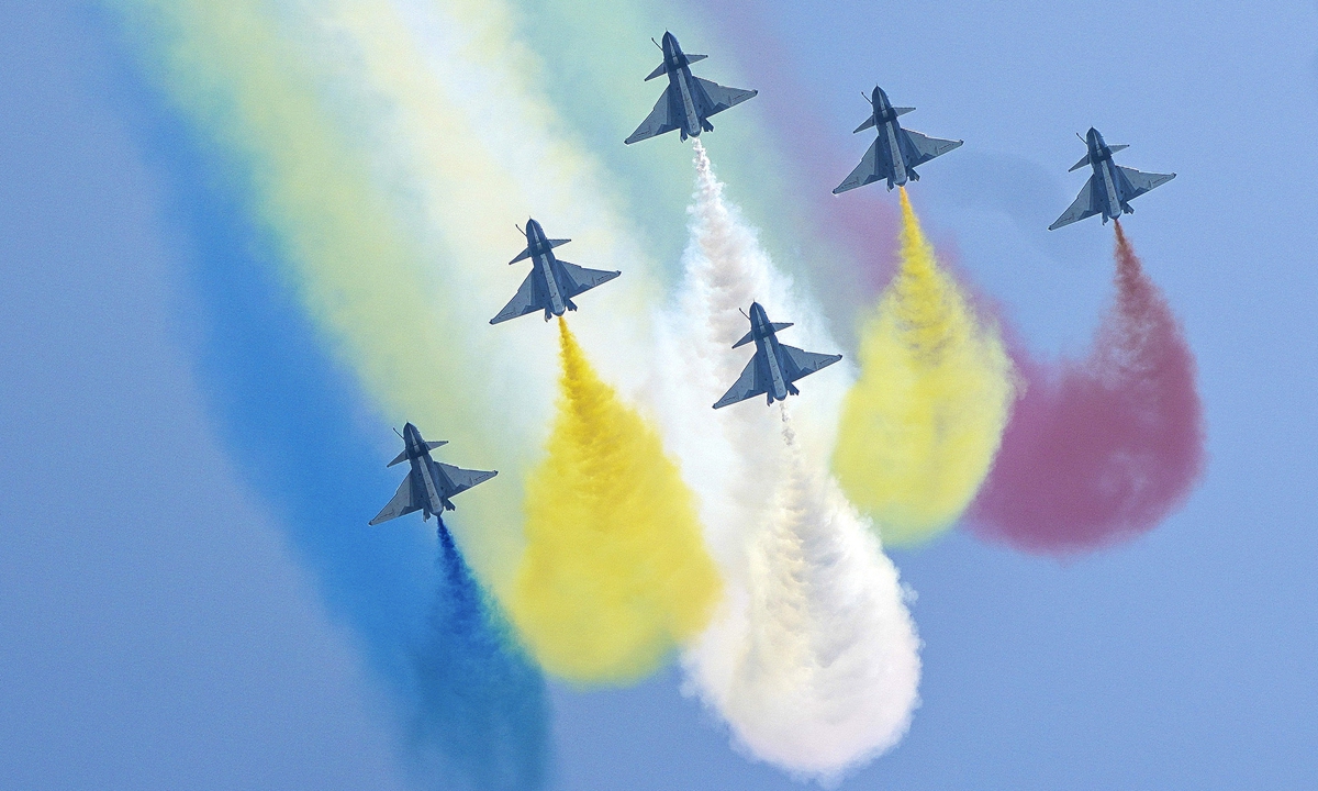 The Red Falcon Air Demonstration Team of the People's Liberation Army Air Force conducts an aerial performance at the opening ceremony of the 13th China International Aviation and Aerospace Exhibition, or Airshow China 2021, in Zhuhai, South China's Guangdong Province on Tuesday. China's J-20 stealth fighter jets with domestically made engines also made their debut at the airshow. Photo: Xinhua