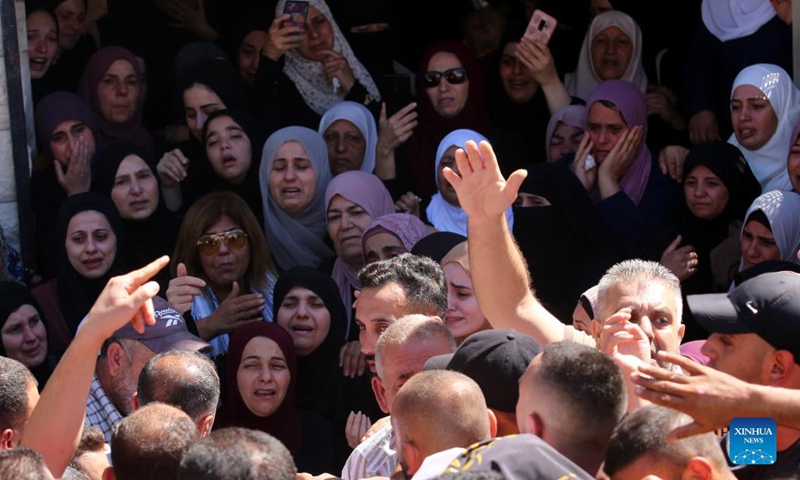 People attend the funeral of Palestinian Osama Soboh in Burqin village west of the West Bank city of Jenin, on Sept. 26, 2021. Palestine on Sunday condemned Israeli soldiers for killing five Palestinians in two separate incidents in northern West Bank and northwest of Jerusalem.(Photo: Xinhua)