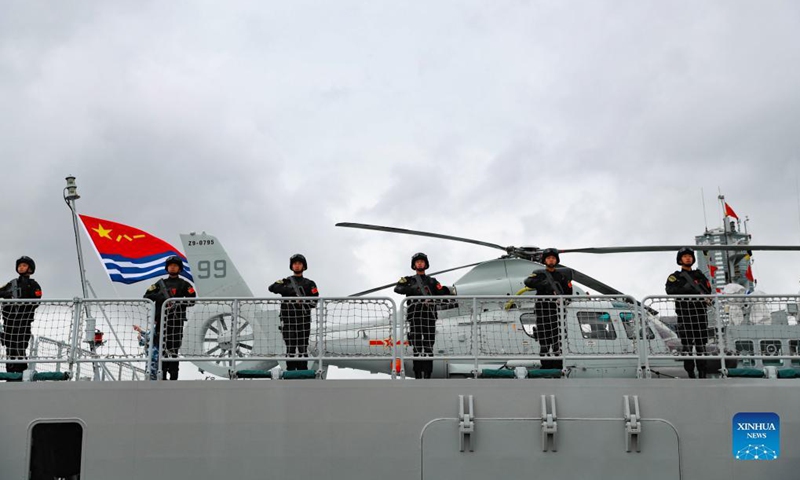 The 39th fleet of the Chinese People's Liberation Army (PLA) Navy sets out to conduct an escort mission in the Gulf of Aden and the waters off Somalia, at a port in Qingdao, east China's Shandong Province, Sept. 26, 2021. The fleet is composed of the guided-missile destroyer <em>Urumqi</em>, the missile frigate Yantai, and the supply ship <em>Taihu</em>, with dozens of special-operations soldiers and two helicopters on board.(Photo: Xinhua)