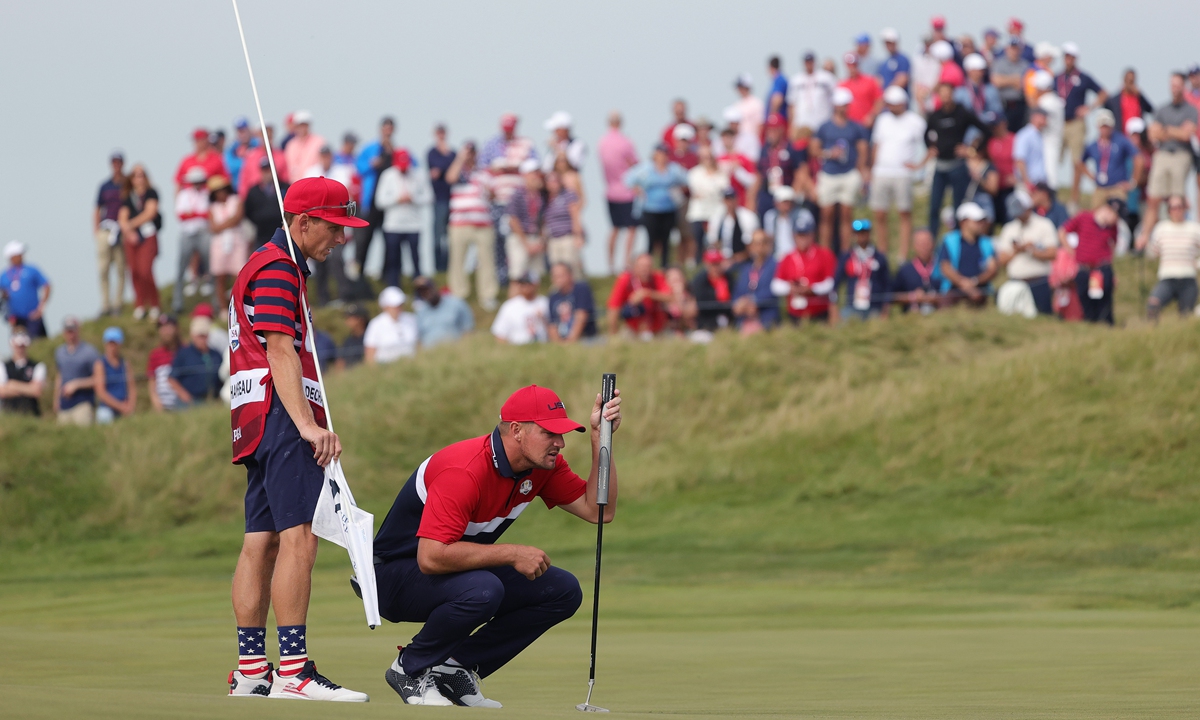 Bryson DeChambeau of the US lines up a putt on the 14th green during Sunday Singles Matches of the 43rd Ryder Cup on Sunday in Kohler, Wisconsin. Photo: VCG