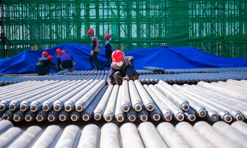 Workers work at the construction site of the Vientiane Railway Station of the China-Laos Railway in Vientiane, Laos, Nov. 19, 2020.(Photo: Xinhua)