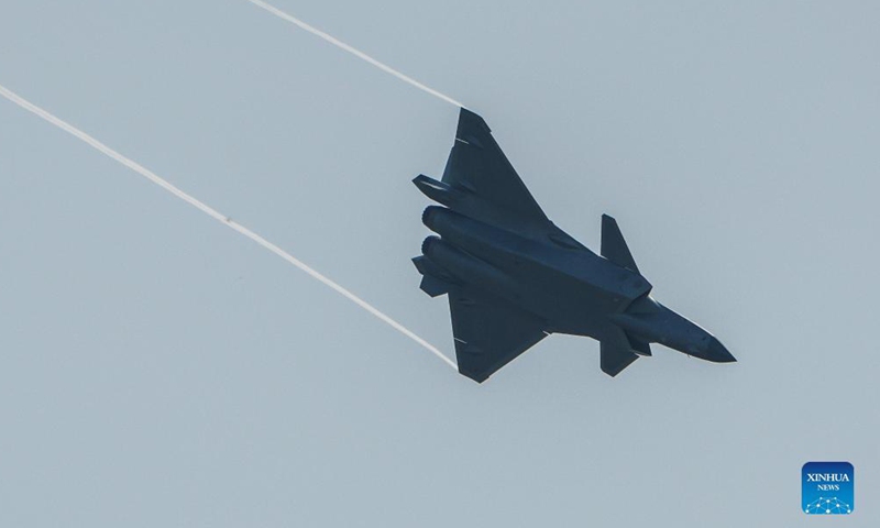 A J-20 stealth fighter jet performs aerobatics during the 13th China International Aviation and Aerospace Exhibition, or Airshow China 2021, in Zhuhai, south China's Guangdong Province, Sept. 29, 2021.Photo:Xinhua