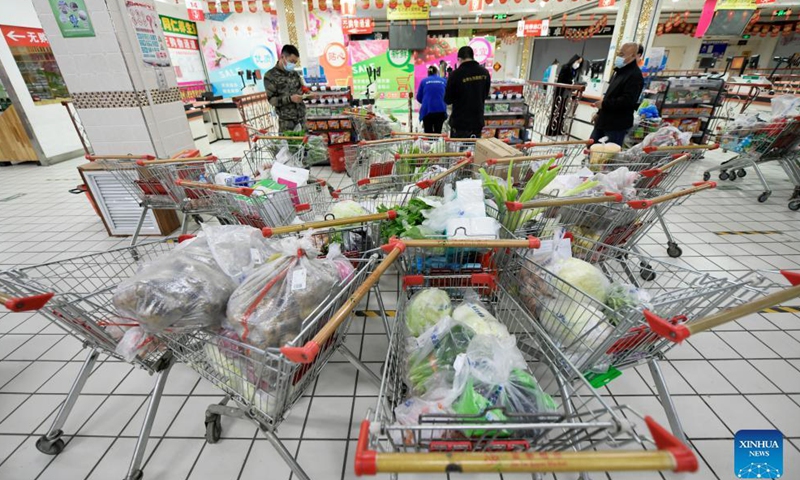 Daily necessities are ready to be delivered to residents under close-off management at a supermarket in Bayan County of Harbin, northeast China's Heilongjiang Province, Sept. 27, 2021.Photo:Xinhua