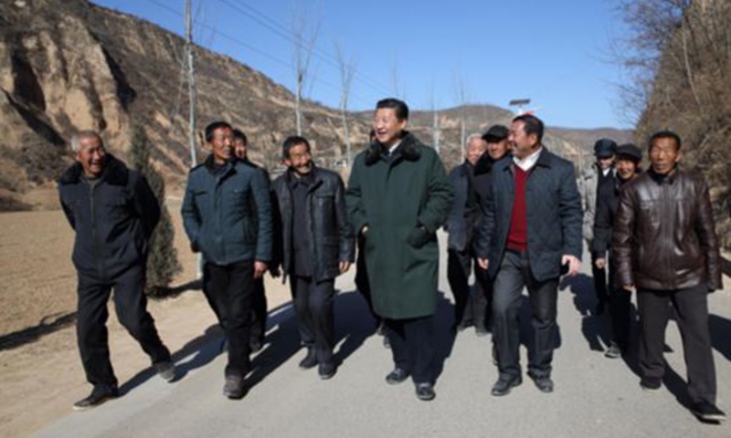 Xi Jinping calls on villagers of Liangjiahe on February 13, 2015.