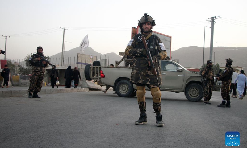 Afghan Taliban members stand guard at the site of a blast in Kabul, capital of Afghanistan, Oct. 3, 2021. At least two civilians were killed and four others wounded after an explosion occurred at the middle of a crowd outside a big mosque in Kabul, capital of Afghanistan, on Sunday, a Taliban spokesman confirmed.(Photo: Xinhua)