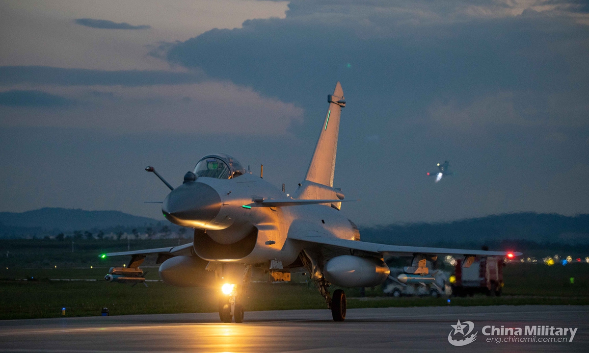 A fighter jet attached to an aviation brigade of the air force under the PLA Southern Theater Command taxies on the runway to get ready for a round-the-clock training exercise on Sept. 8, 2021. (eng.chinamil.com.cn/Photo by Wang Guoyun)
