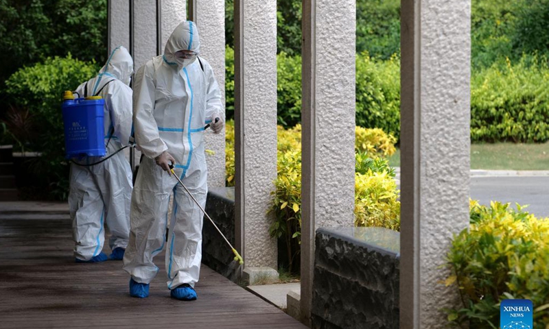 Firemen disinfect a wetland park in Xiamen, southeast China's Fujian Province, Oct. 5, 2021. Outdoor public places in Xiamen started to reopen from Oct. 5, as the results of the sixth round of citywide nucleic acid testing all came out negative. (Photo :Xinhua) 