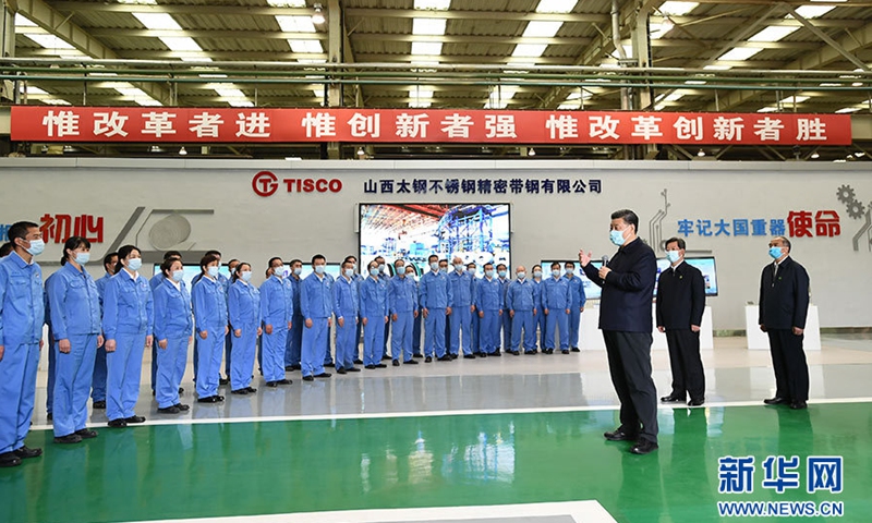 Xi Jinping talks with employees of the Fine Stainless Strip Steel Co., Ltd. of TISCO on May 12, 2020.