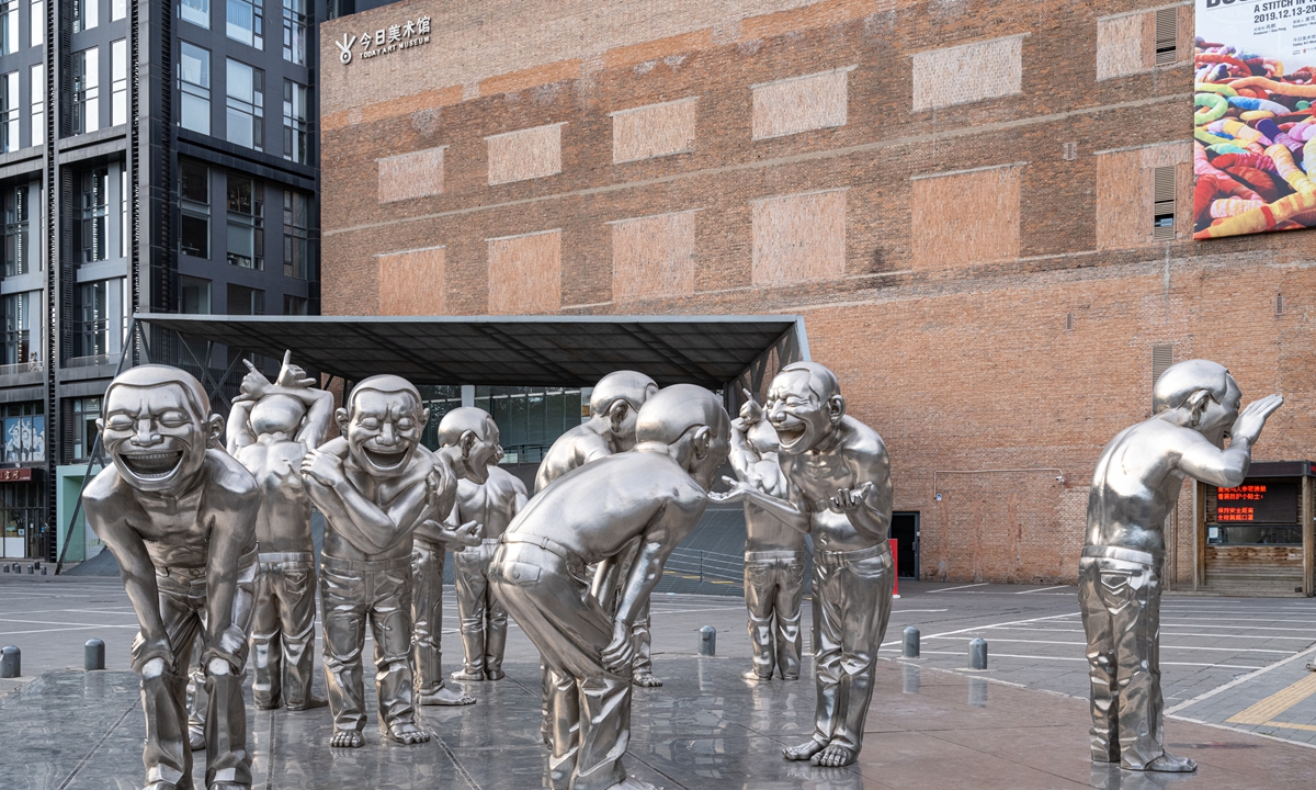 Sculptures created by Chinese artist Yue Minjun on display in front of the Today Art Museum in Beijing in May 2020 Photo: VCG