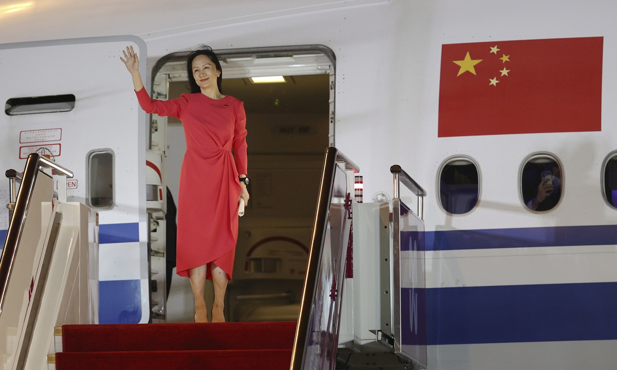 Huawei CFO Meng Wanzhou waves as she steps out of a plane upon arrival following her release, in Shenzhen, South China's Guangdong Province on September 25. Photo: IC