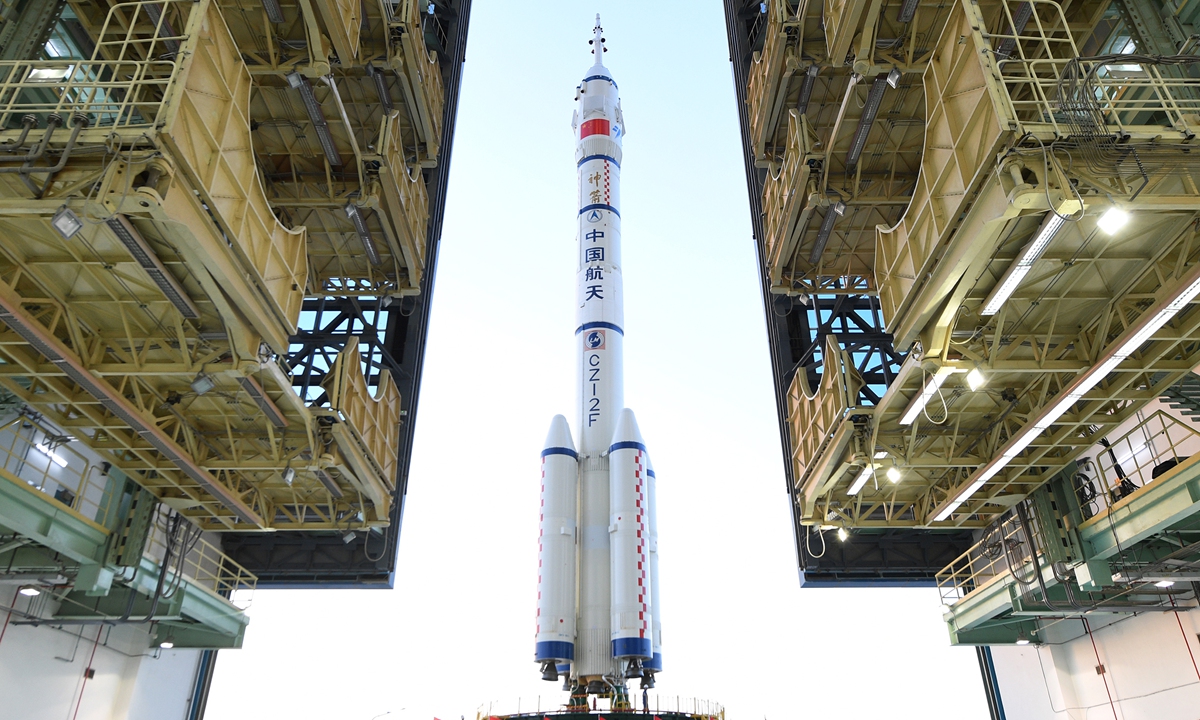 The combination of Shenzhou-13 manned spacecraft and Long March-2F Y13 carrier rocket rolled out to launch pad in Jiuquan Satellite Launch Center in Northwest China's Gansu Province on Thursday. The upcoming mission is expected to send three taikonauts to China’s Tianhe space station core module for record-long six-month stay in orbit.  Photo: Wang Jiangbo
