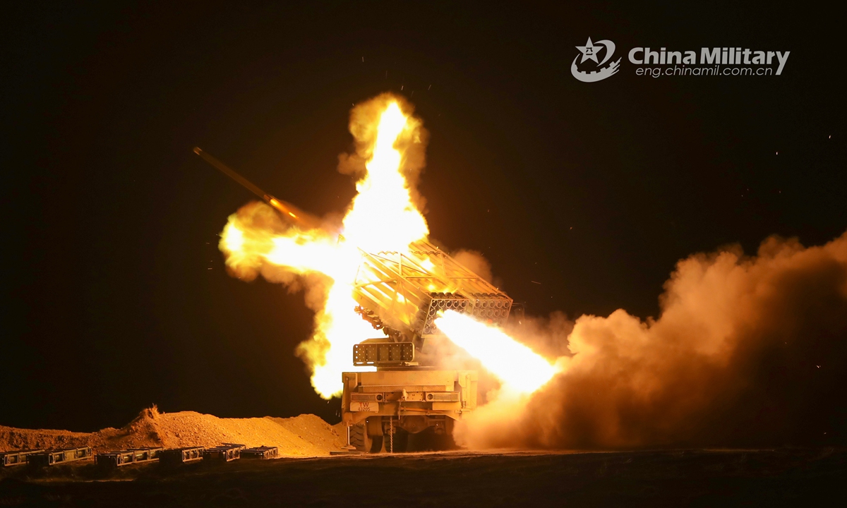 A vehicle-mounted rocket launcher attached to an artillery contingent of a regiment under the PLA Xinjiang Military Command fires at mock targets during a round-the-clock live-fire training exercise on September 30, 2021. (eng.chinamil.com.cn/Photo by Huang Feihao)