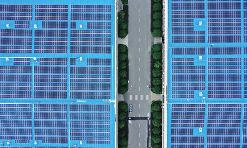 Solar panels on the roof of a company in Yueqing, East China's Zhejiang Province are seen in an aerial photo on Sunday. The city, which is pushing for green-driven economic growth, is home to 6,520 independent distributed solar photovoltaic projects, with annual power generation hitting nearly 100 million kilowatt hours. Photo: cnsphoto