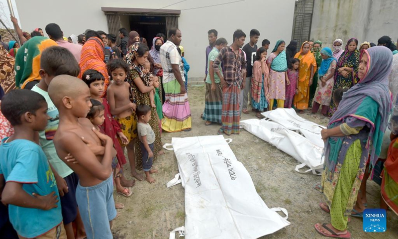 Bodies of victims following a boat accident are seen in Savar on the outskirts of Dhaka, Bangladesh, Oct. 9, 2021. At least five bodies were recovered after a boat capsized in the Turag river in Savar, on the outskirts of Bangladesh capital Dhaka on Saturday. According to the official, the boat carrying about 18 people capsized following a collision with a sand-carrying vessel in the river in the early hours of Saturday.(Photo: Xinhua)