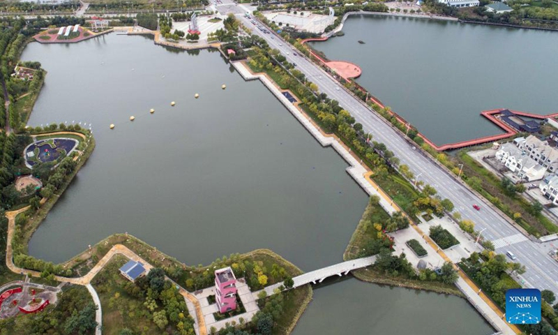 Aerial photo taken on Oct. 10, 2021 shows scenery of the Nanhai park in Huanghua City, north China's Hebei Province. In recent years, the coastal city of Huanghua has renovated abandoned pits, ponds and depressions with high degree of soil salinization, and built more than 80 parks and gardens. The urban ecological environment has been improved and citizens has more leisure space. (Xinhua/Luo Xuefeng)

