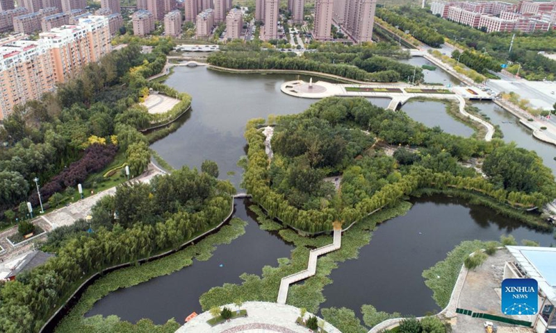 Aerial photo taken on Oct. 10, 2021 shows scenery of the Wenxinghu park in Huanghua City, north China's Hebei Province. In recent years, the coastal city of Huanghua has renovated abandoned pits, ponds and depressions with high degree of soil salinization, and built more than 80 parks and gardens. The urban ecological environment has been improved and citizens has more leisure space. (Xinhua/Luo Xuefeng)