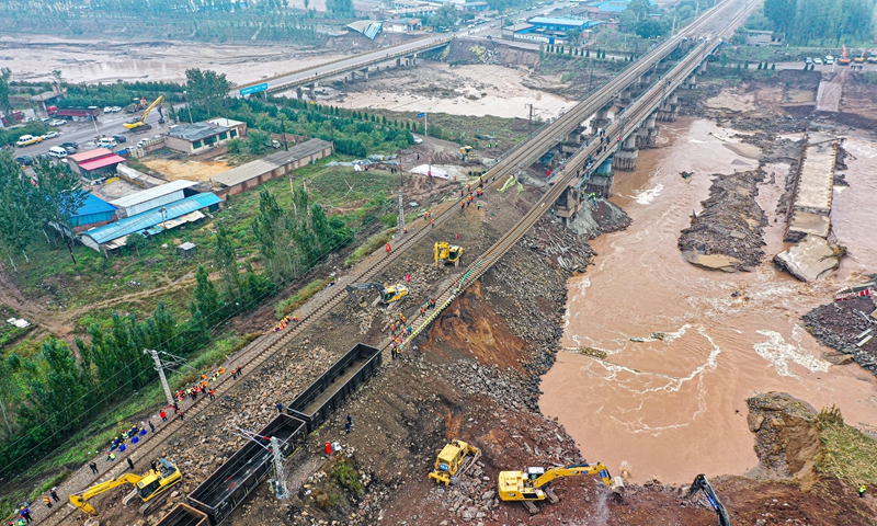 The Railway on the Changyuan River bridge was reopened on Saturday in Jinzhong, North China's Shanxi Province. The railway that crosses the bridge was destroyed by flooding on Wednesday. Photo: VCG