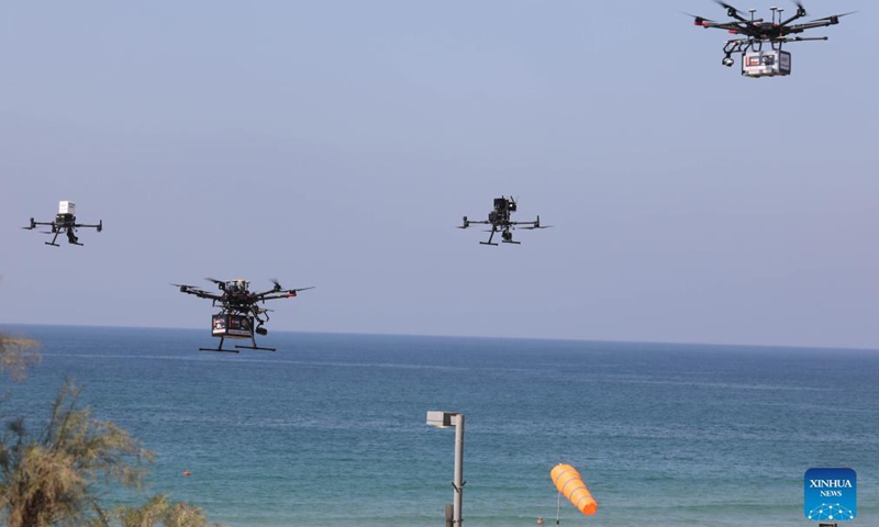 A presentation to the media shows drones delivering goods in the coastal Israeli city of Tel Aviv on Oct. 11, 2021. (Photo by Gil Cohen Magen/Xinhua)