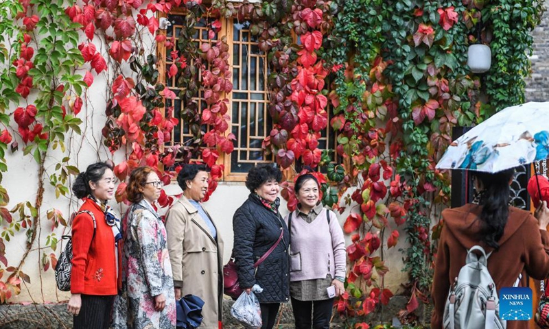 Elders pose for group photo at a scenic spot in Zhongshan District of Liupanshui, southwest China's Guizhou Province, Oct. 14, 2021.Photo:Xinhua