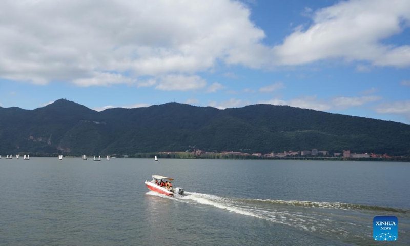A speedboat cruises on the Dianchi Lake in Kunming, southwest China's Yunnan Province, Oct. 13, 2021.Photo:Xinhua