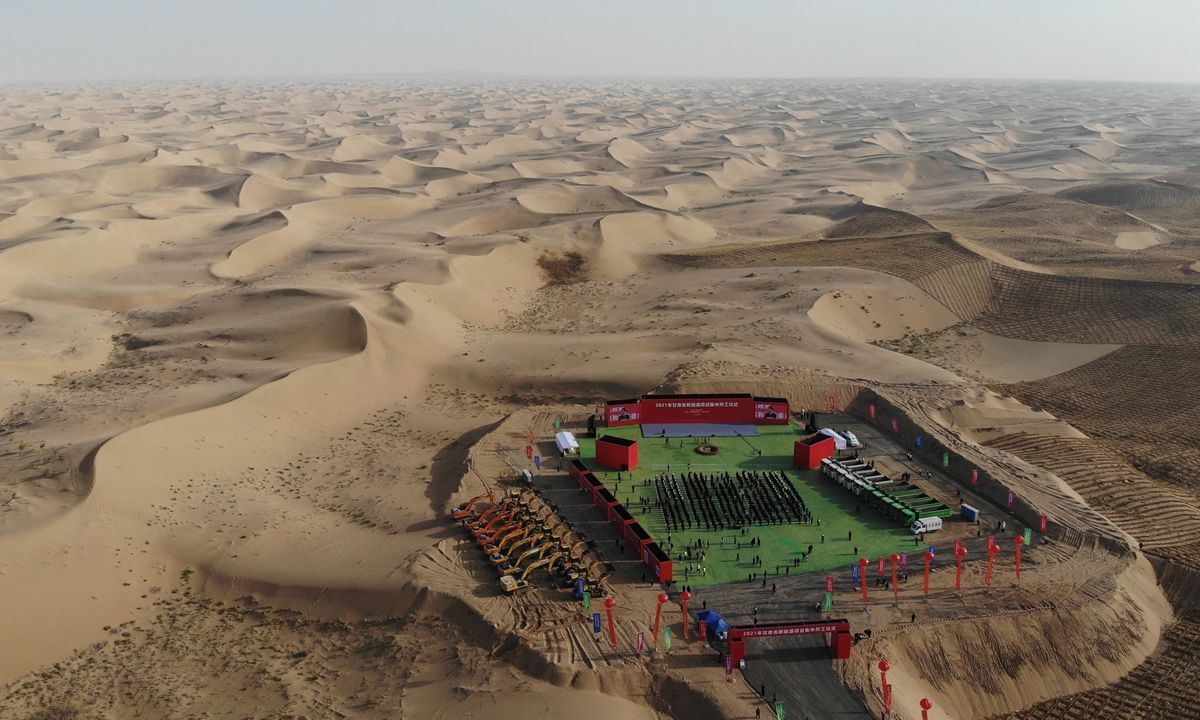 
Wuwei city in Northwest China's Gansu Province holds an energy project groundbreaking ceremony on Friday. Several cities in the province held such a ceremony on the same day with a total scale of 12.85 million kilowatts. China recently started constructing a massive wind- and solar-power project in the country's deserts, and construction has started smoothly on the first phase of 100 gigawatts of generating capacity. 
Photo: cnsphoto