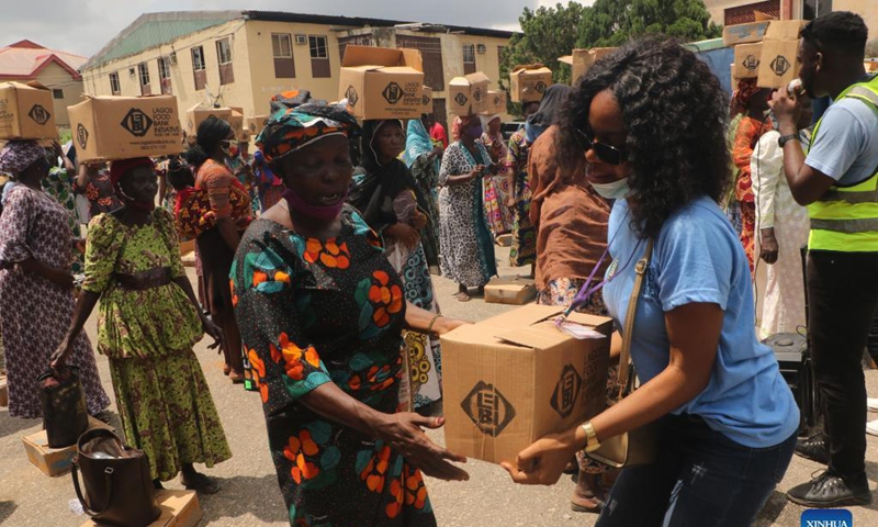 People receive food parcels during the food distribution for vulnerable families in the Lagos State, Nigeria, on Oct. 16, 2021. The event was to mark World Food Day, which falls on Oct. 16.Photo: Xinhua 