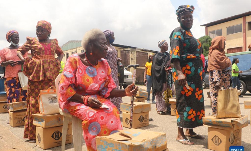 People wait to receive food parcels during the food distribution for vulnerable families in the Lagos State, Nigeria, on Oct. 16, 2021. The event was to mark World Food Day, which falls on Oct. 16.Photo: Xinhua 