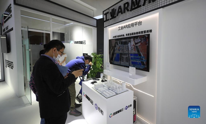 Participants experience an industrial AR application platform of Baidu Cloud at an auxiliary exhibition during the 2021 Global Industrial Internet Conference in Shenyang, capital of northeast China's Liaoning Province, Oct. 18, 2021. The 2021 Global Industrial Internet Conference kicked off here on Monday.Photo: Xinhua