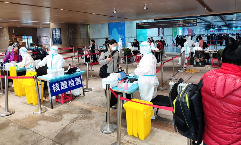 The Xi'an Railway Station in Northwest China's Shaanxi Province conducts a nucleic acid test among tourists on Sunday. Photo: VCG