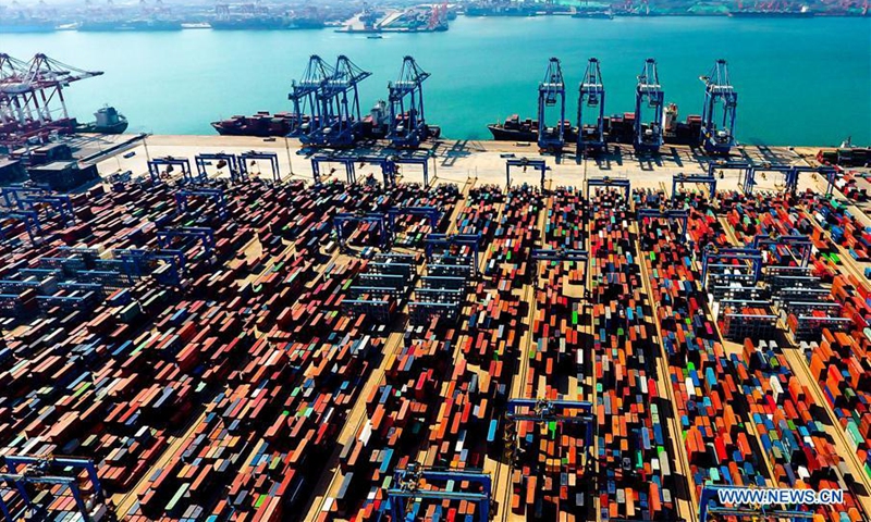 Aerial photo taken on May 4, 2018 shows an automatic container dock in Qingdao, east China's Shandong Province. China's gross domestic product expanded 6.8 percent year on year in the first half of 2018 to about 41.90 trillion yuan (6.27 trillion U.S. dollars), data from the National Bureau of Statistics (NBS) showed Monday.(Photo: Xinhua)
