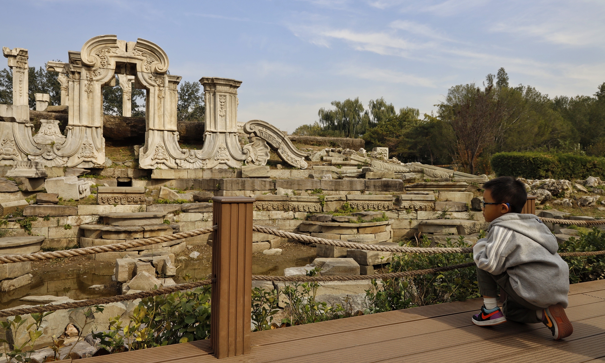 The Old Summer Palace in Beijing, the imperial garden ruined in late Qing Dynasty (1644-1911), provides free entry to the public Monday, the 161st anniversary of the burning and massive looting it suffered. Exhibitions commemorating that phase of sorrowful history were held in the garden. Photo: Li Hao/Global Times 