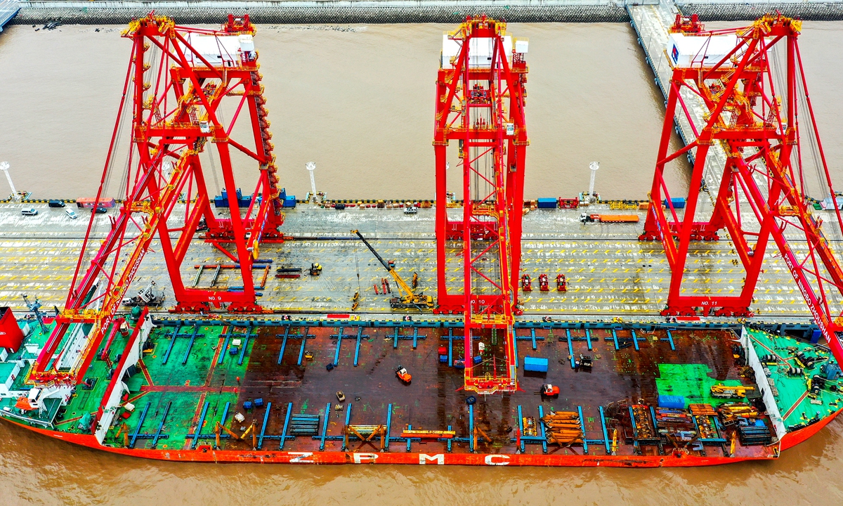 Aerial photo shows a remote control automated bridge crane onshore on Monday in Zhoushan port, East China's Jiangsu Province. China's Ministry of Transportation recently announced a five-year plan for the construction of new types of basic infrastructure, under which accelerating the building of intelligent and unmanned ports was listed as a priority. Photo: cnsphoto