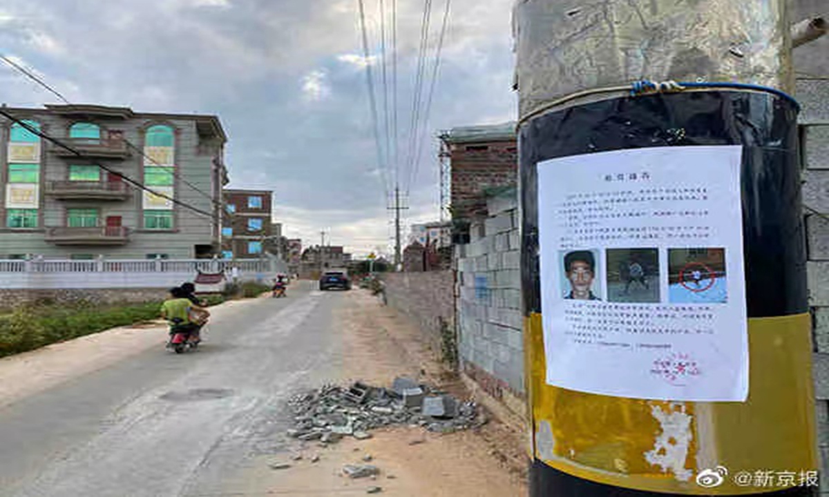The police's notice of rewards for the case is hung in the village in Putian, East China's Fujian, where the murder took place on October 10. Photo: media