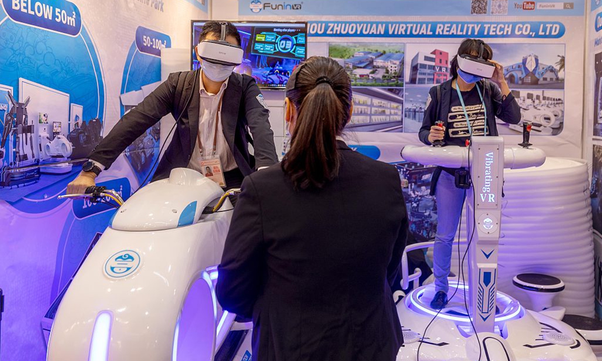 Visitors experience VR products at the 130th China Import and Export Fair on October 18, 2021. Photo: CFP