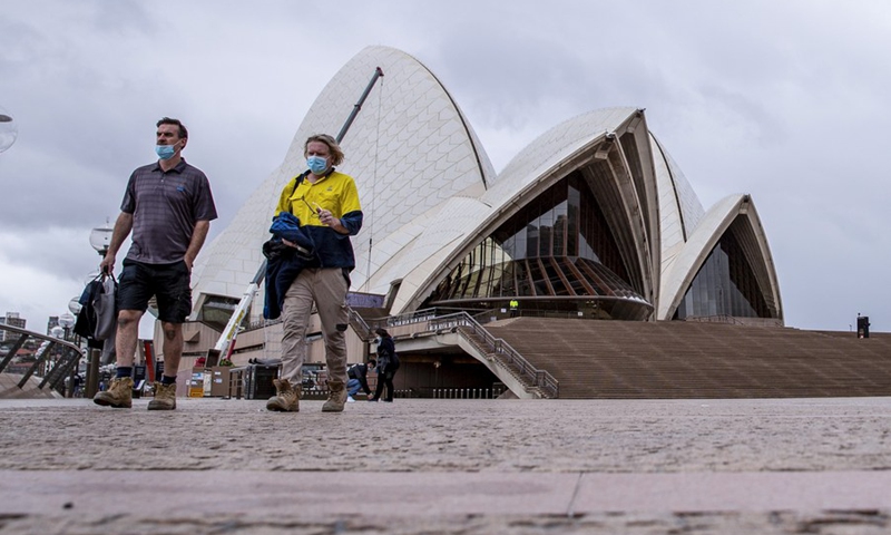 People walk in front of Sydney Opera House in Sydney, Australia, on Oct. 11, 2021.(Photo: Xinhua)