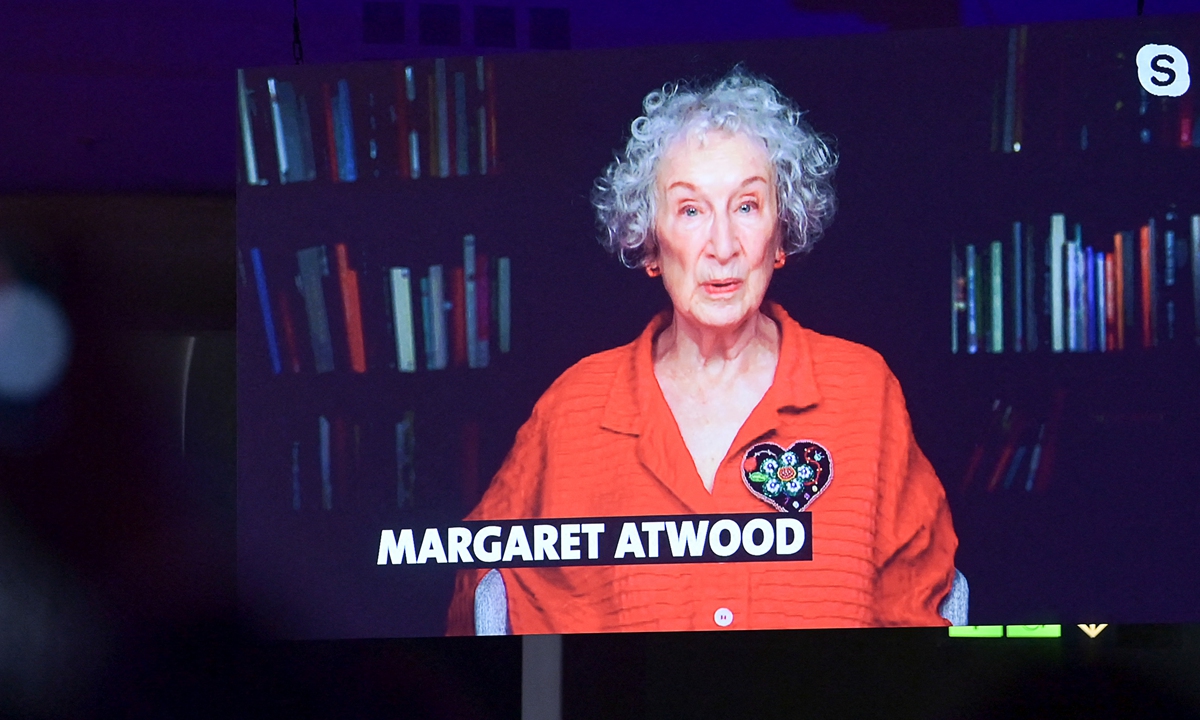 Vivek Shraya, author and performance artist, speaks during the opening ceremony of the Frankfurt Book Fair 2021 in the Festsaal. Below: Margaret Atwood, author, speaks live from Canada during the opening ceremony of the Frankfurt Book Fair 2021. Photos: AFP