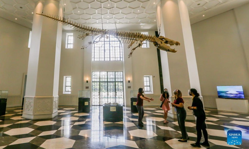 Visitors listen to a guide as they visit the Philippine National Museum in Manila, the Philippines on Oct. 19, 2021. The Philippine National Museum reopened its doors to visitors on Tuesday as lockdown restrictions in Metro Manila is being eased, which allows more public establishments in the capital to operate at limited capacities.(Photo: Xinhua)