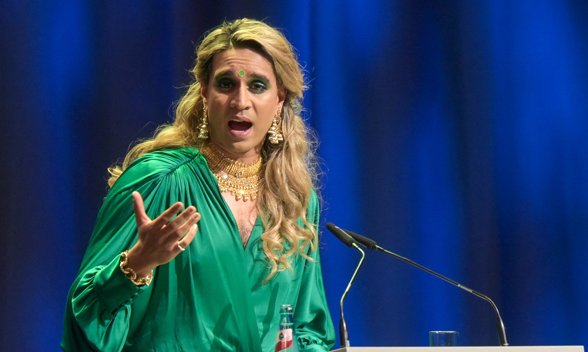 Vivek Shraya, author and performance artist, speaks during the opening ceremony of the Frankfurt Book Fair 2021 in the Festsaal. Below: Margaret Atwood, author, speaks live from Canada during the opening ceremony of the Frankfurt Book Fair 2021. Photos: AFP