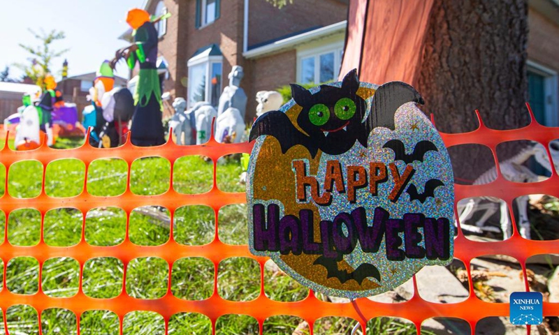 Halloween decorations are seen in front of a house in Mississauga, Ontario, Canada, on Oct. 19, 2021. Some residents in Ontario started to decorate their houses for the upcoming Halloween.(Photo: Xinhua)
