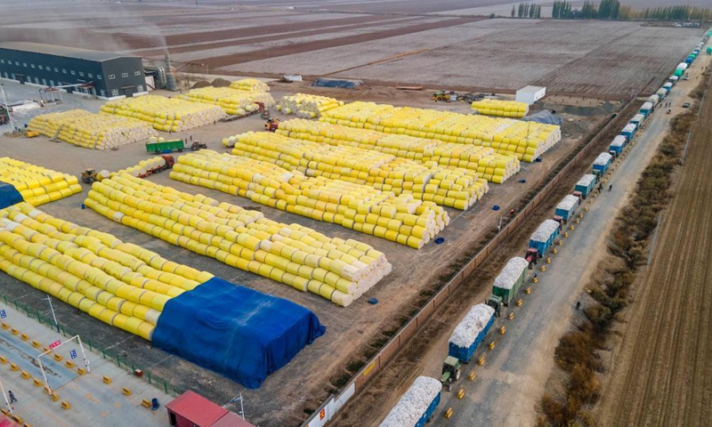 Aerial photo shows farmers wait to sell cotton outside a cotton company in Shawan, northwest China's Xinjiang Uygur Autonomous Region, Oct. 20, 2021.Photo:Xinhua