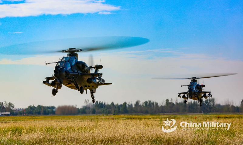 Two helicopters attached to an army aviation brigade under the PLA 80th Group Army hover above the grassland during a flight training exercise aiming to hone the troops' combat capabilities on October 12, 2021. (eng.chinamil.com.cn/Photo by Li Peng)
