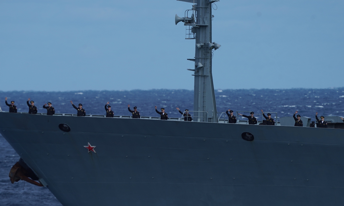 Russian soldiers wave at a ceremony on October 23, the last day of the first China-Russia joint sea patrol which started on October 17. Photo: Xinhua 