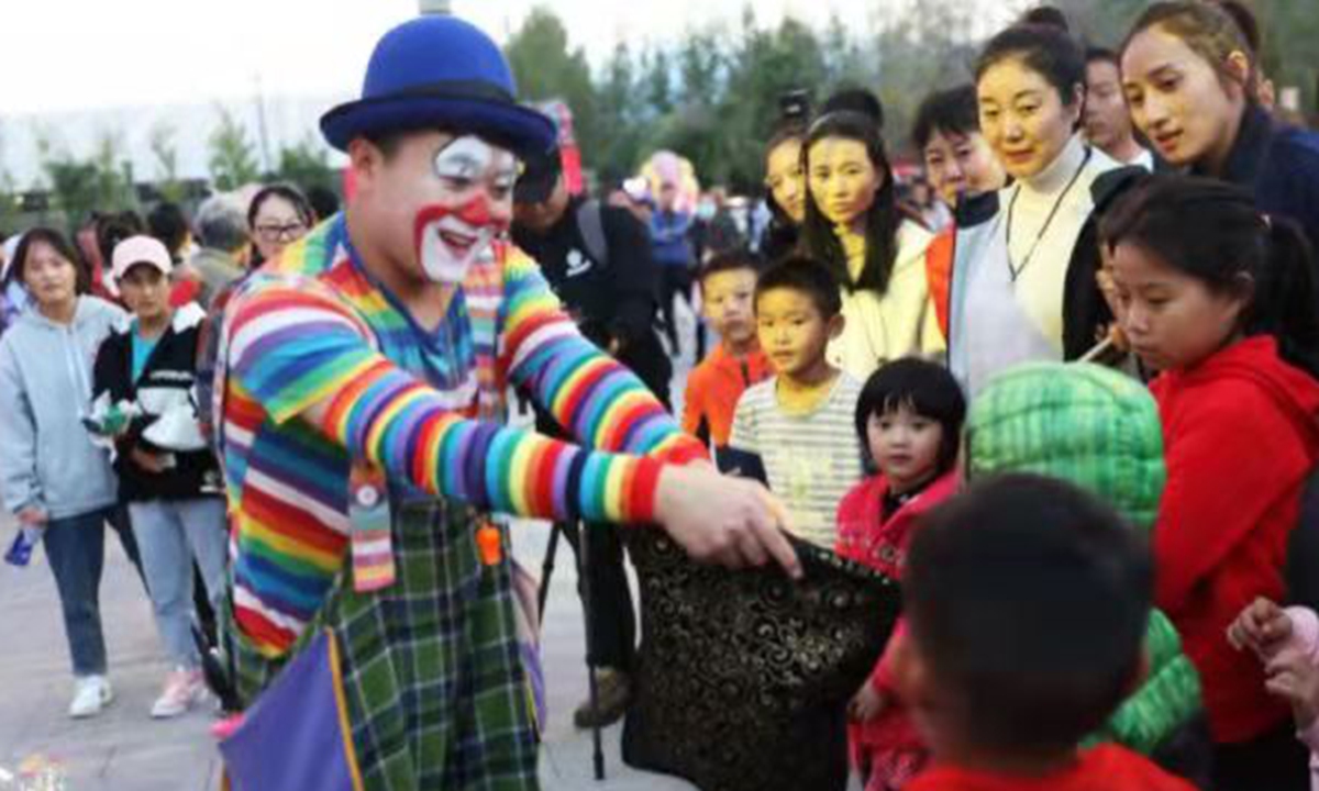 Employee plays joker at the theater festival in Xichang, capital of the Liangshan Yi Autonomous Prefecture in Southwest China's Sichuan Province. Photo: Courtesy of Wen xin 